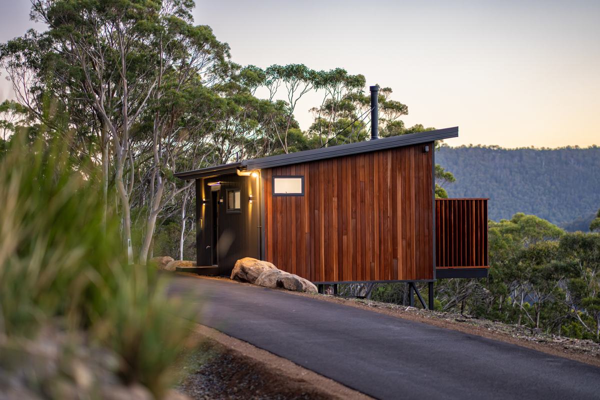 Timber-clad Breath cabin surrounded by native forest in Fern Tree.